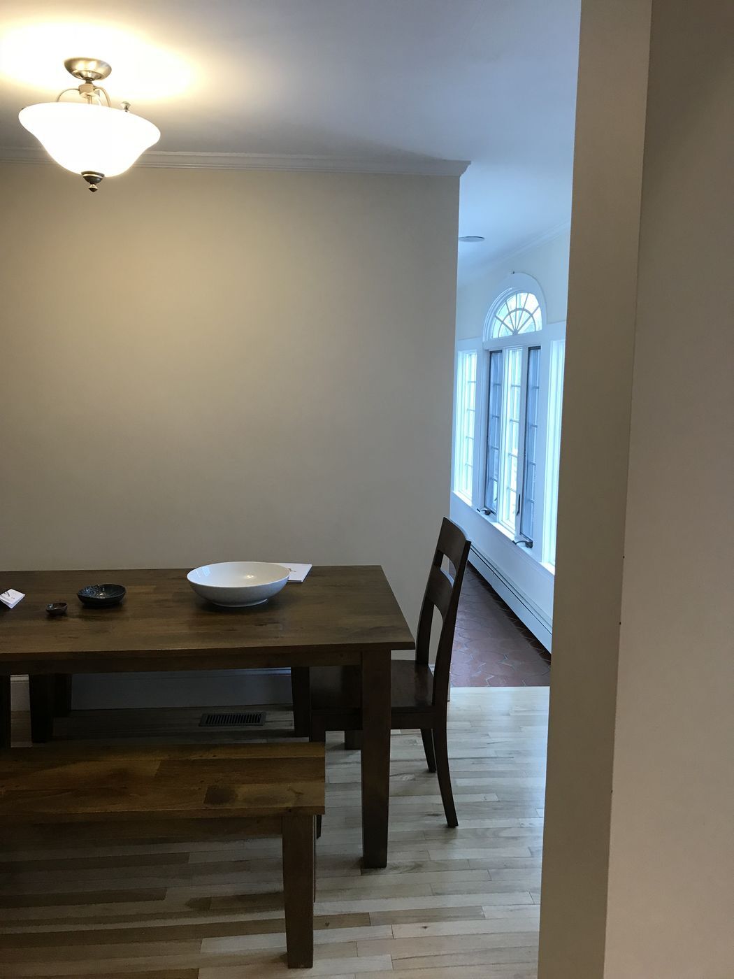 Before: Old dining room: this room is now the kitchen, with an island, a range wall and the same back windows.
