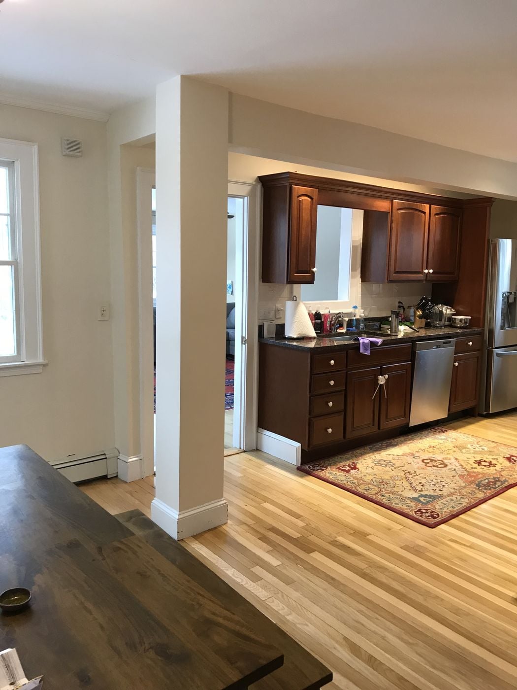 Before: Looking toward the old kitchen: the wall between the rooms came out, making one long open space along the back windows.