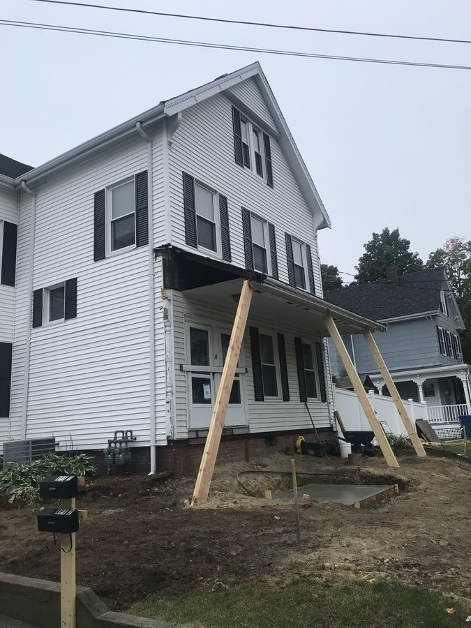 Before: Outside: a new dormer on the side roof gave the attic the headroom for a primary suite.