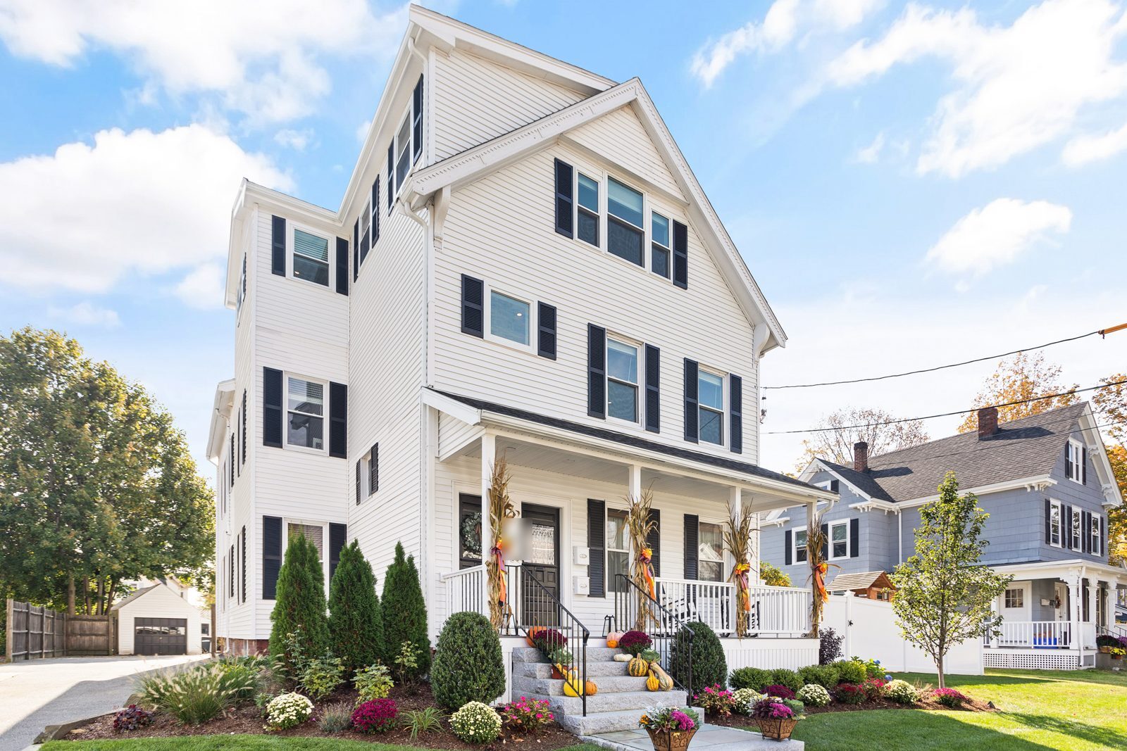 Front of the house in Wakefield, MA after the attic conversion, with the new dormer on the third floor