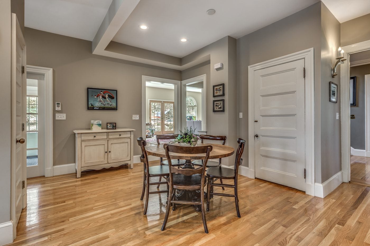 After: Eating area: a cramped corner with a radiator became an open dining spot under a coffered ceiling, with doors out to the family room and yard.