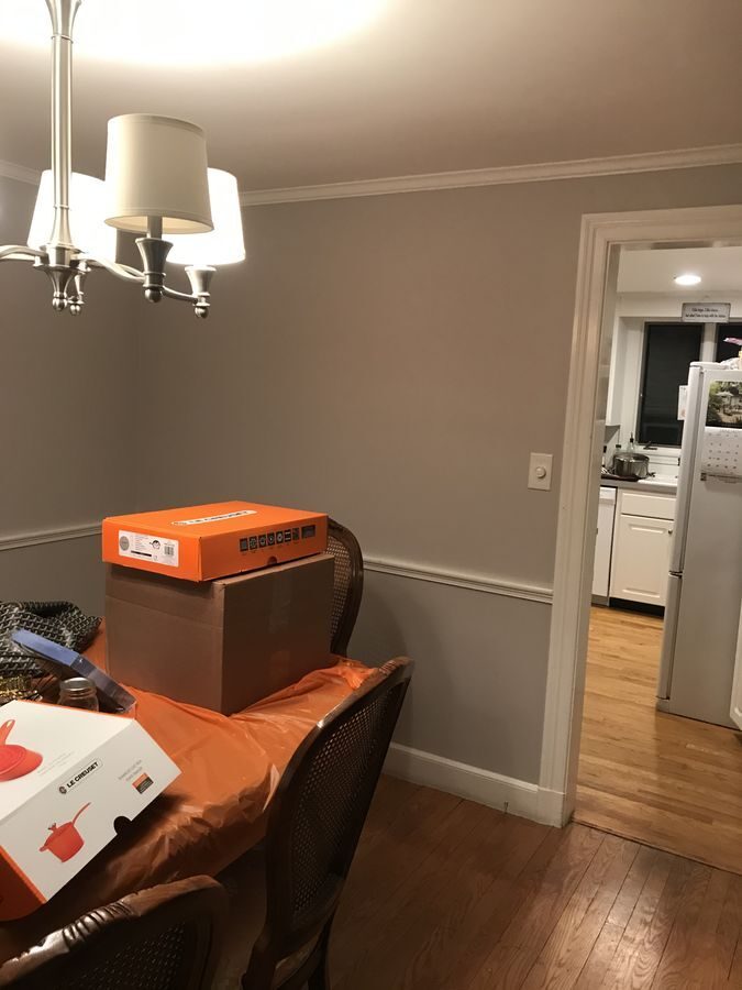 Before: Dining room: the wall and narrow doorway into the kitchen came out, so the table now shares one open room with the island.