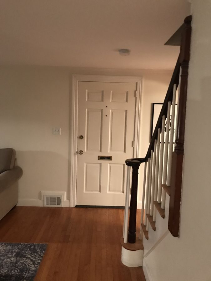 Before: Stairway: the closed-in side of the stair was opened up and it got new oak treads, rail and iron balusters.